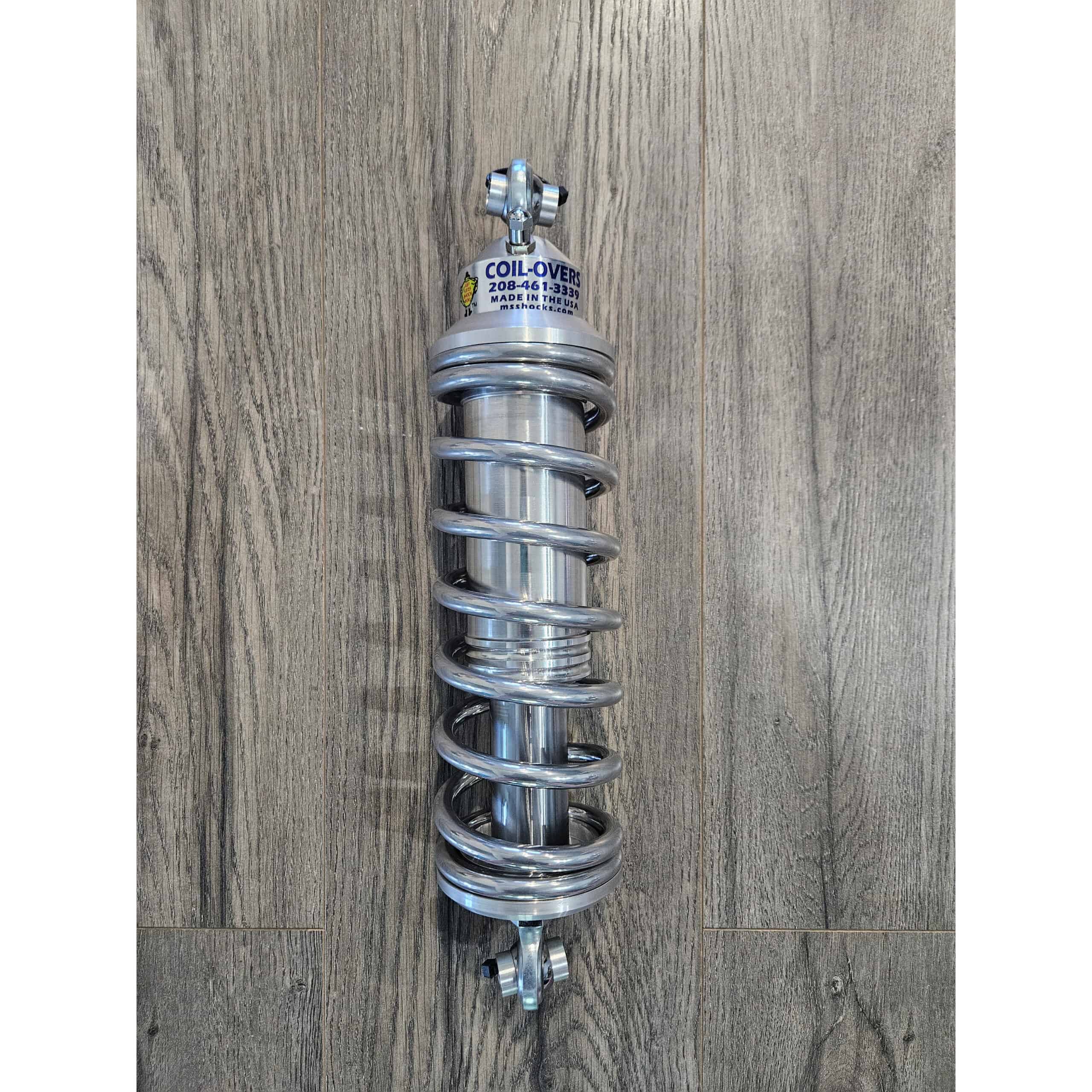 Durable coil-over shock absorber made of high-quality metal for optimal vehicle suspension performance.